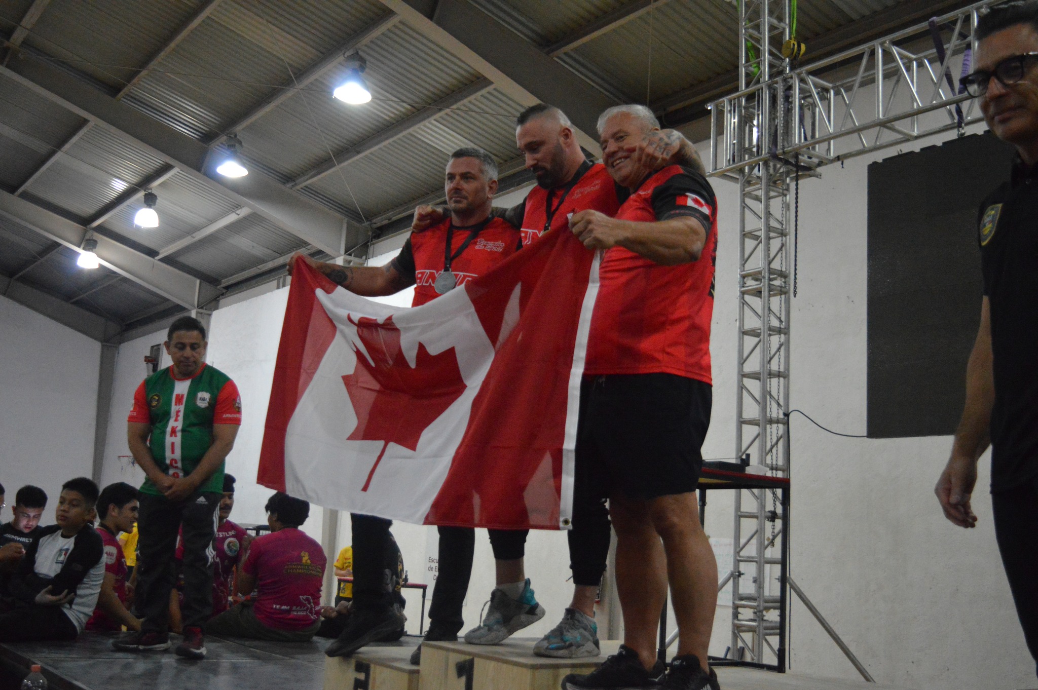 Team Canada athletes celebrating on the podium
